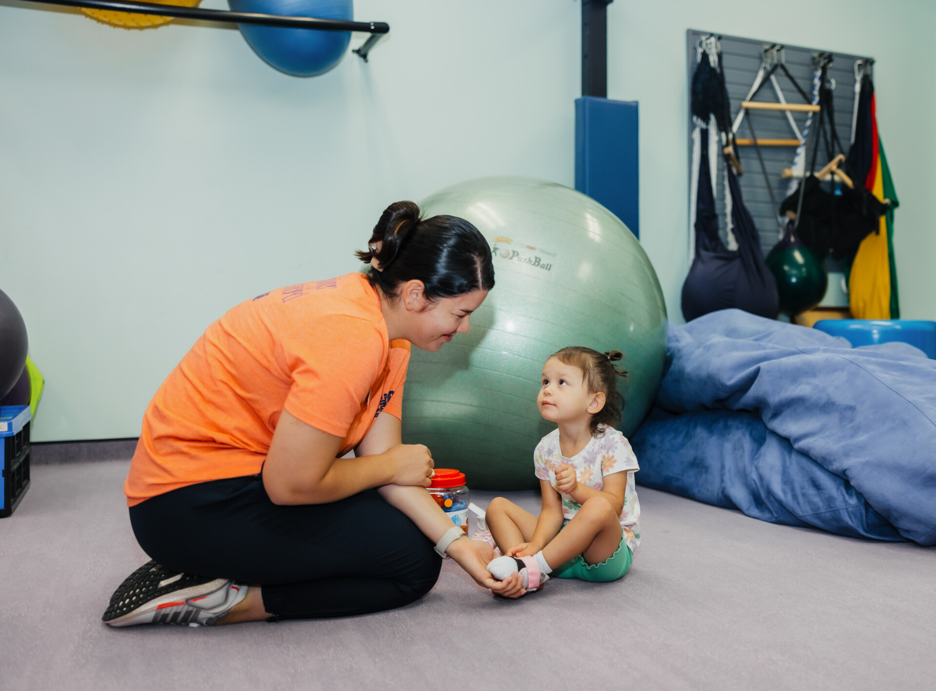 Pediatric therapy patient working on toe walking exercises at West Texas Rehab to improve balance and mobility.