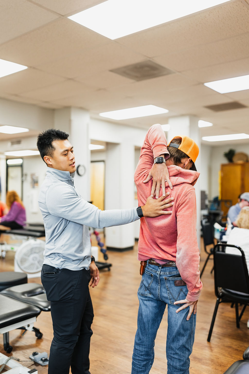 Patient undergoing functional arm movement testing at West Texas Rehab to assess strength and range of motion.