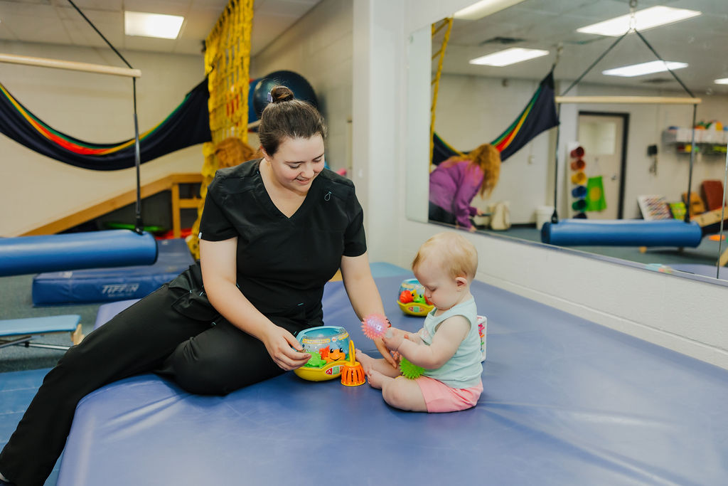 Occupational pediatric therapy patient playing with toys at West Texas Rehab to improve fine motor skills and cognitive development.