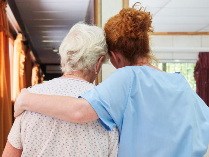 Hospice nurse hugging a family member at West Texas Rehab, offering comfort and support during end-of-life care.